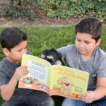 two boys reading Goldy the puppy and the missing socks