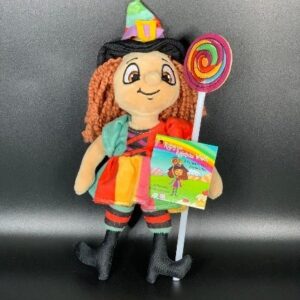 Ruby the rainbow witch doll holding the candy